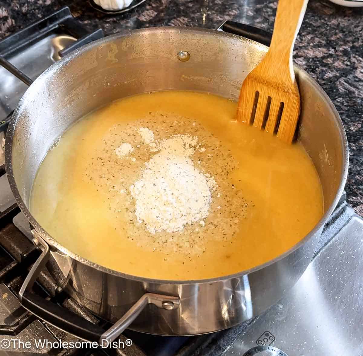 Adding chicken broth and Ranch seasoning.