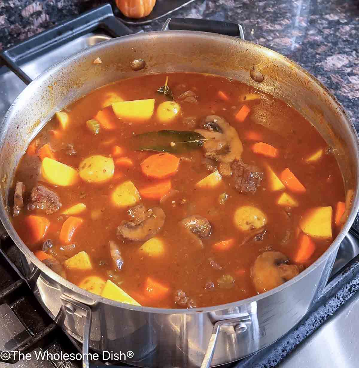 Potatoes and carrots added to the soup.