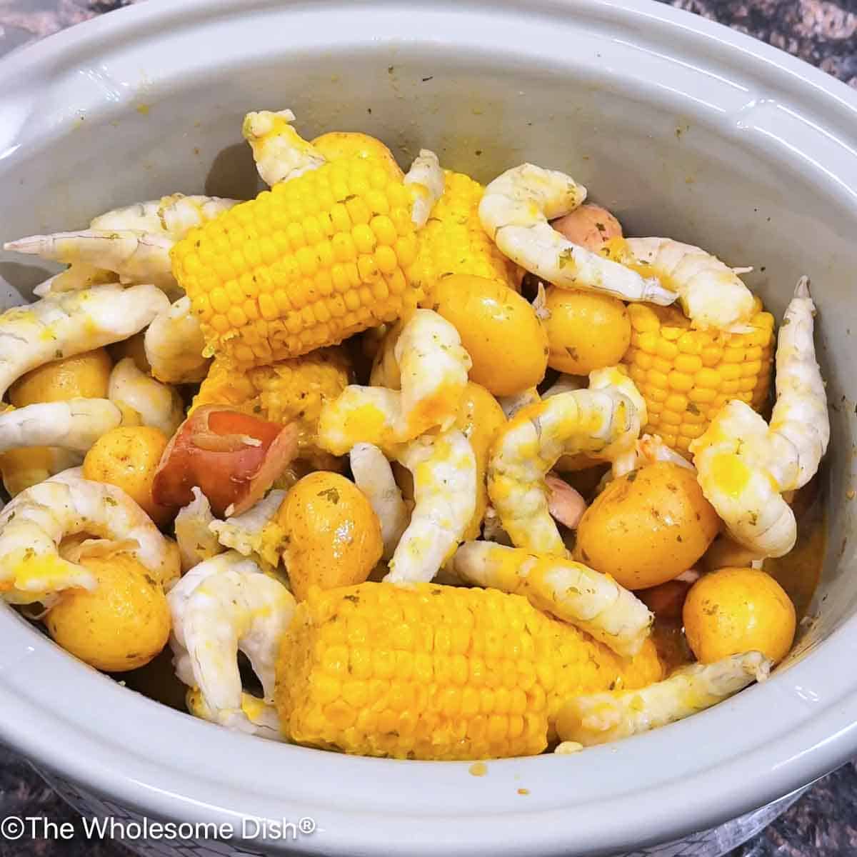 Frozen shrimp added to the crock pot.